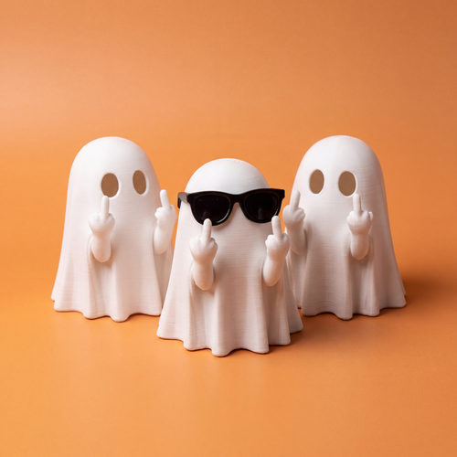 Three matte white 3D-printed ghost figurines, one wearing black sunglasses, on a warm orange studio background
