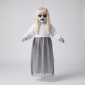 Life-size hanging ghost decoration with pale blonde hair, white lace nightgown and grey mesh skirt, photographed against a plain grey studio background