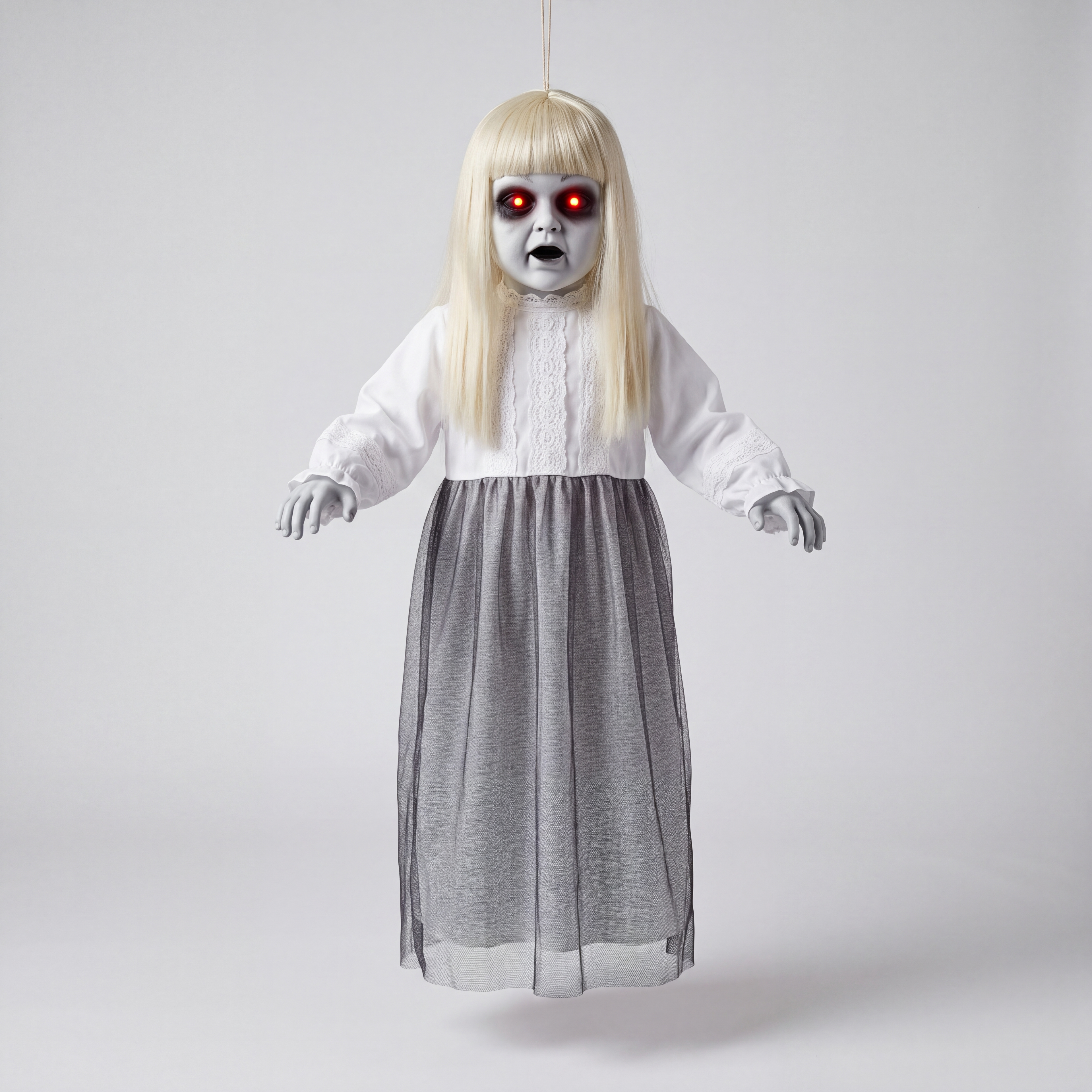 Life-size hanging ghost decoration with pale blonde hair, white lace nightgown and grey mesh skirt, photographed against a plain grey studio background